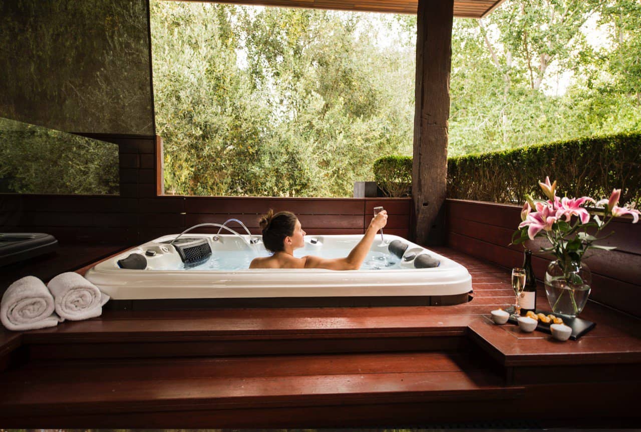 Woman having a spa at the best accommodation in margaret river losari retreat