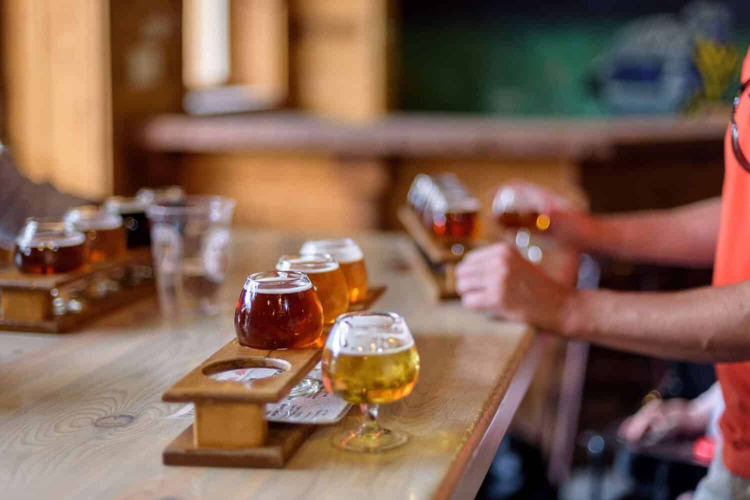 people drinking tasting paddles of beer at a brewery in Margaret River