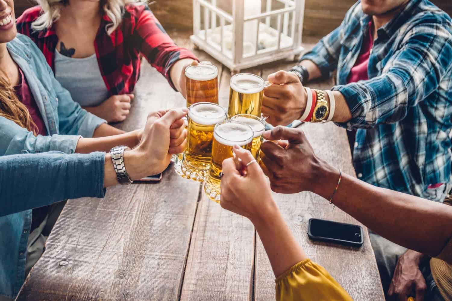 people sitting at a table drinking beer margaret river