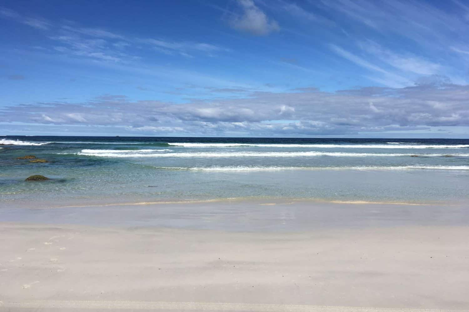 View of water lapping on the shore at Kilcarnup Beach