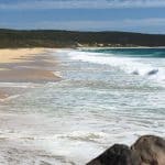 beach in margaret river with waves receding