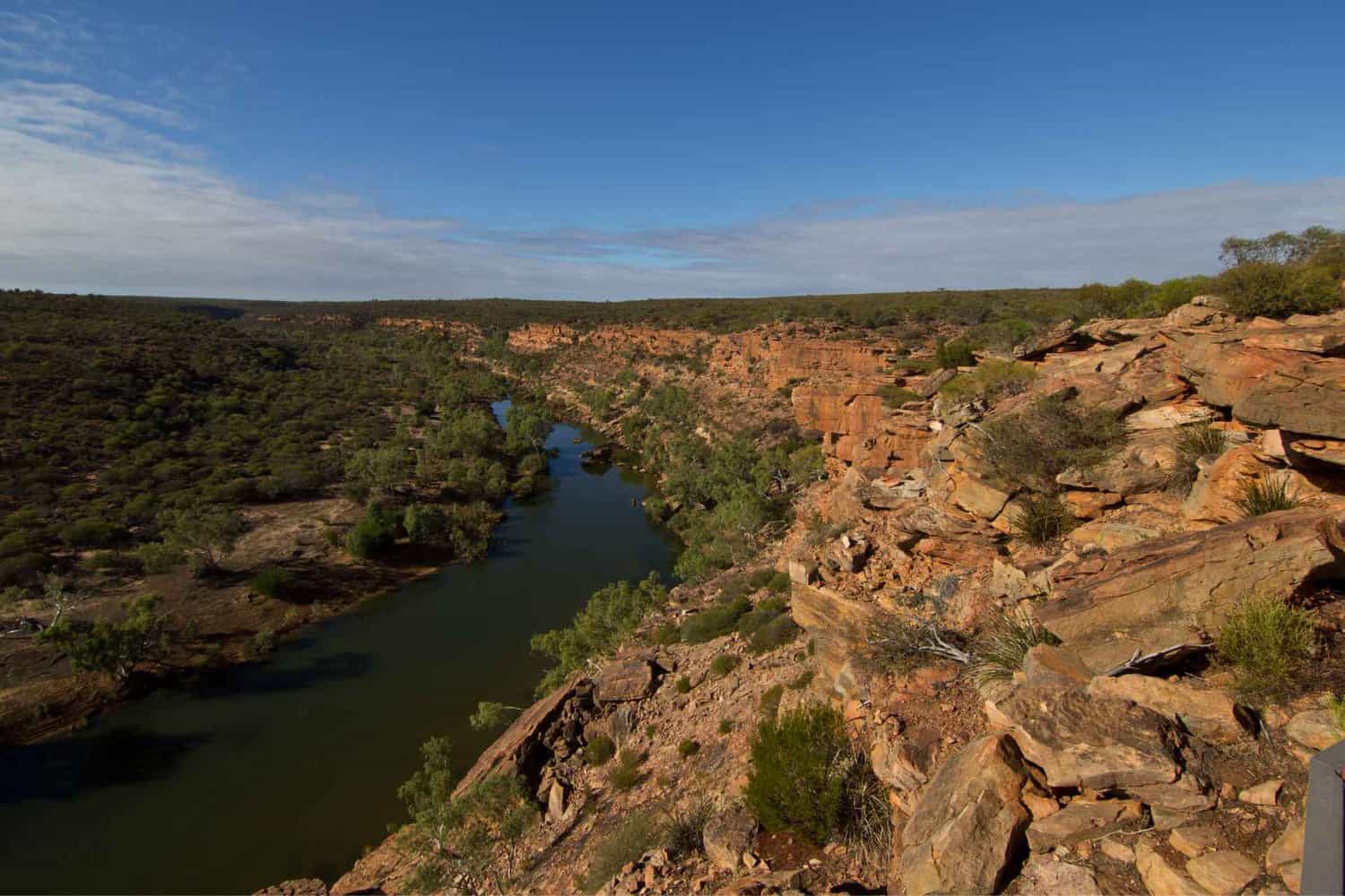 Image of Kalbarri Gorge, with rocky cliff face looking over the river, a nearby attraction of free camping Kalbarri